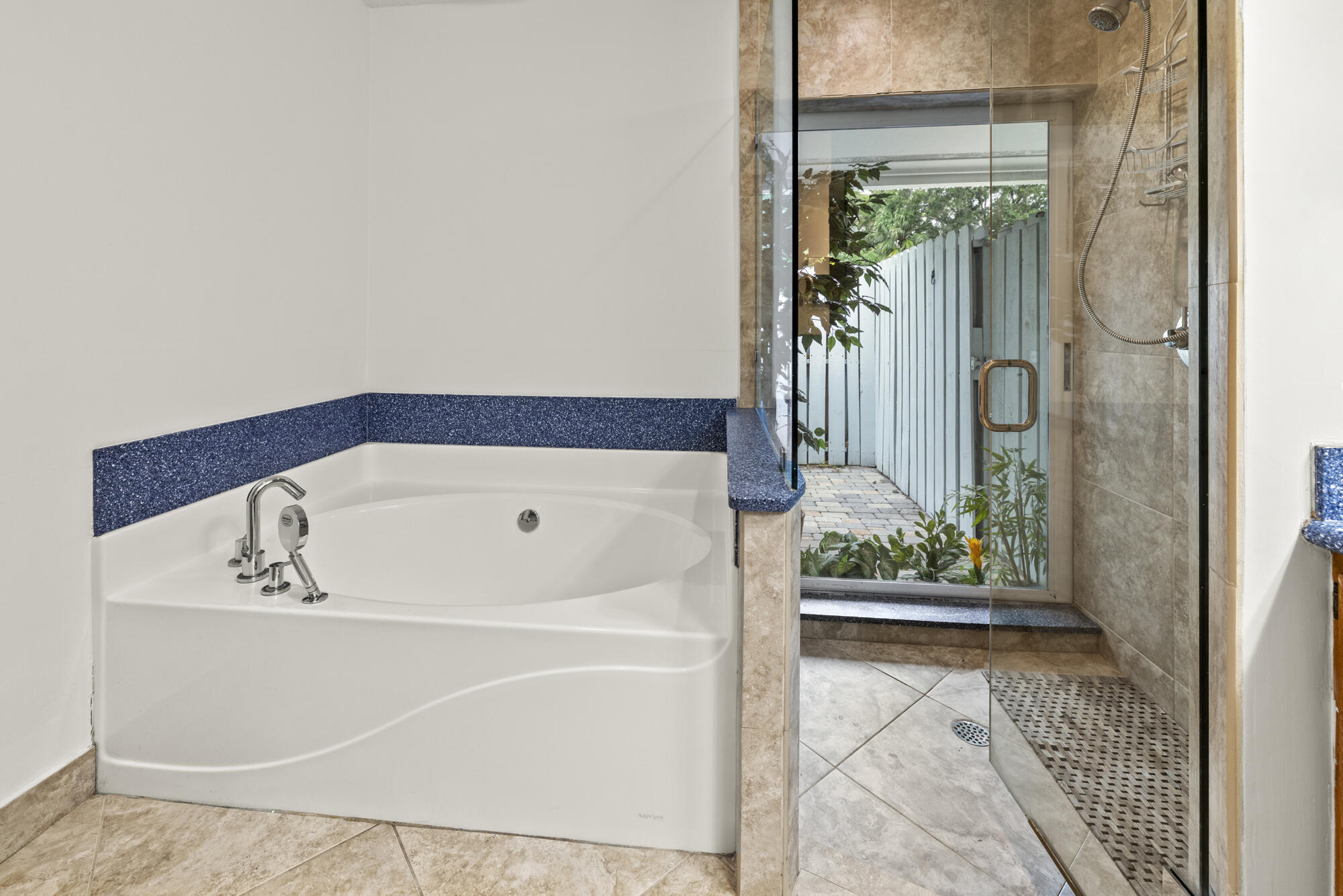 6595 Wood Lake Road Jupiter, FL 33458 - Photo 32 of 54 a bath tub sitting next to a window