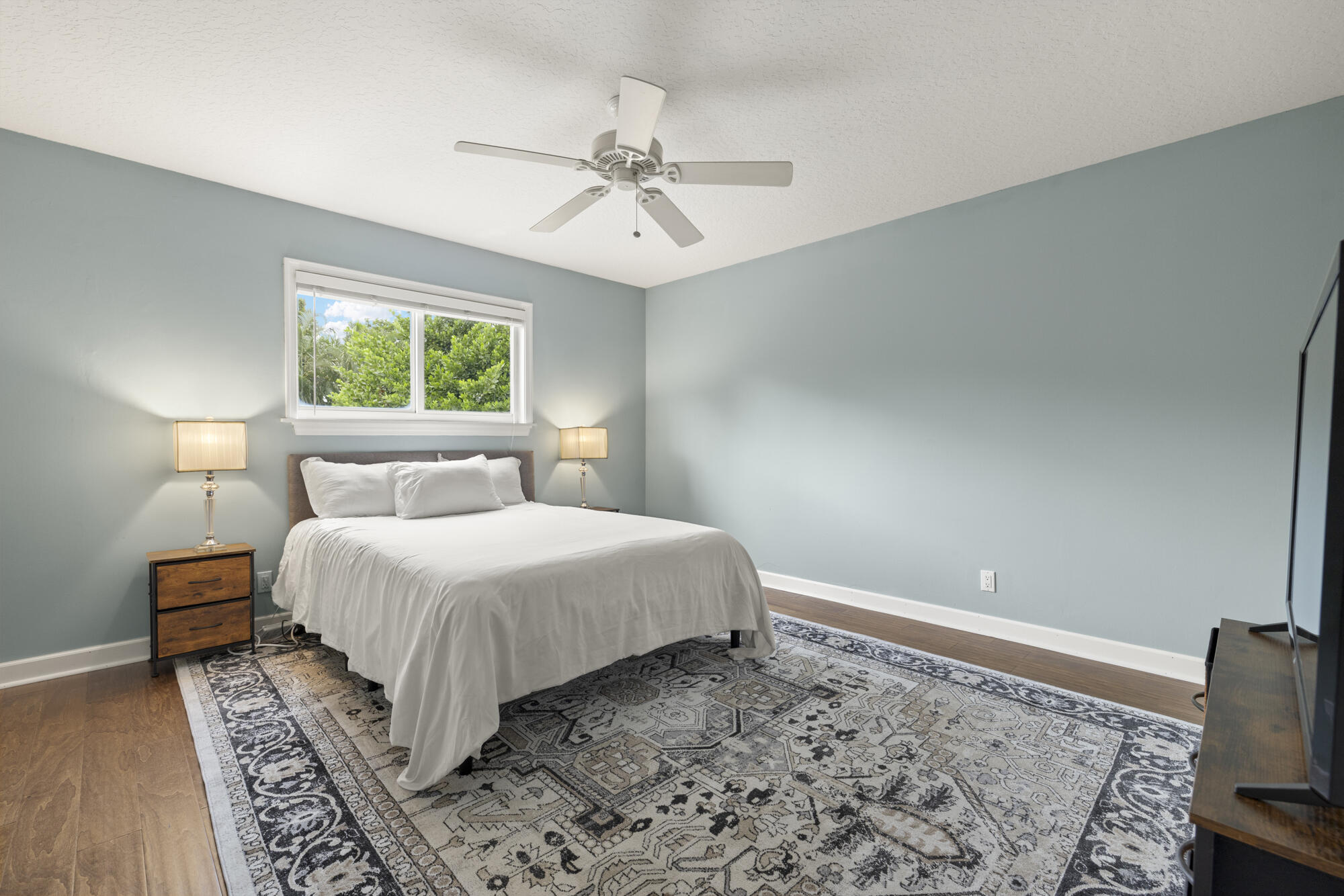6595 Wood Lake Road Jupiter, FL 33458 - Photo 35 of 54 a bedroom with a bed and a dresser
