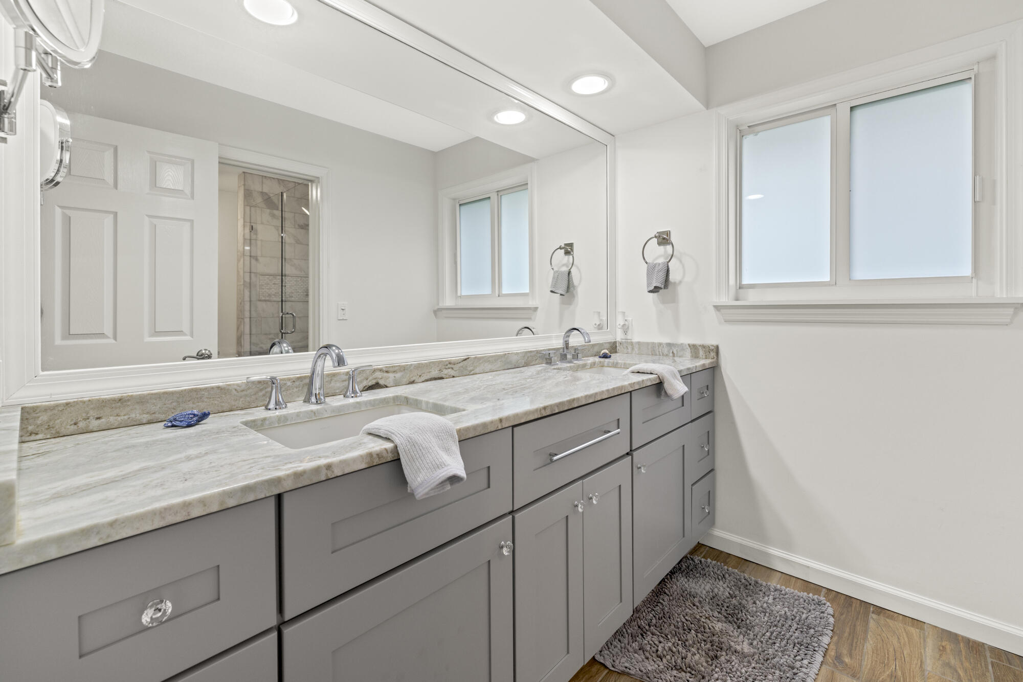 6595 Wood Lake Road Jupiter, FL 33458 - Photo 36 of 54 a bathroom with a sink and a mirror