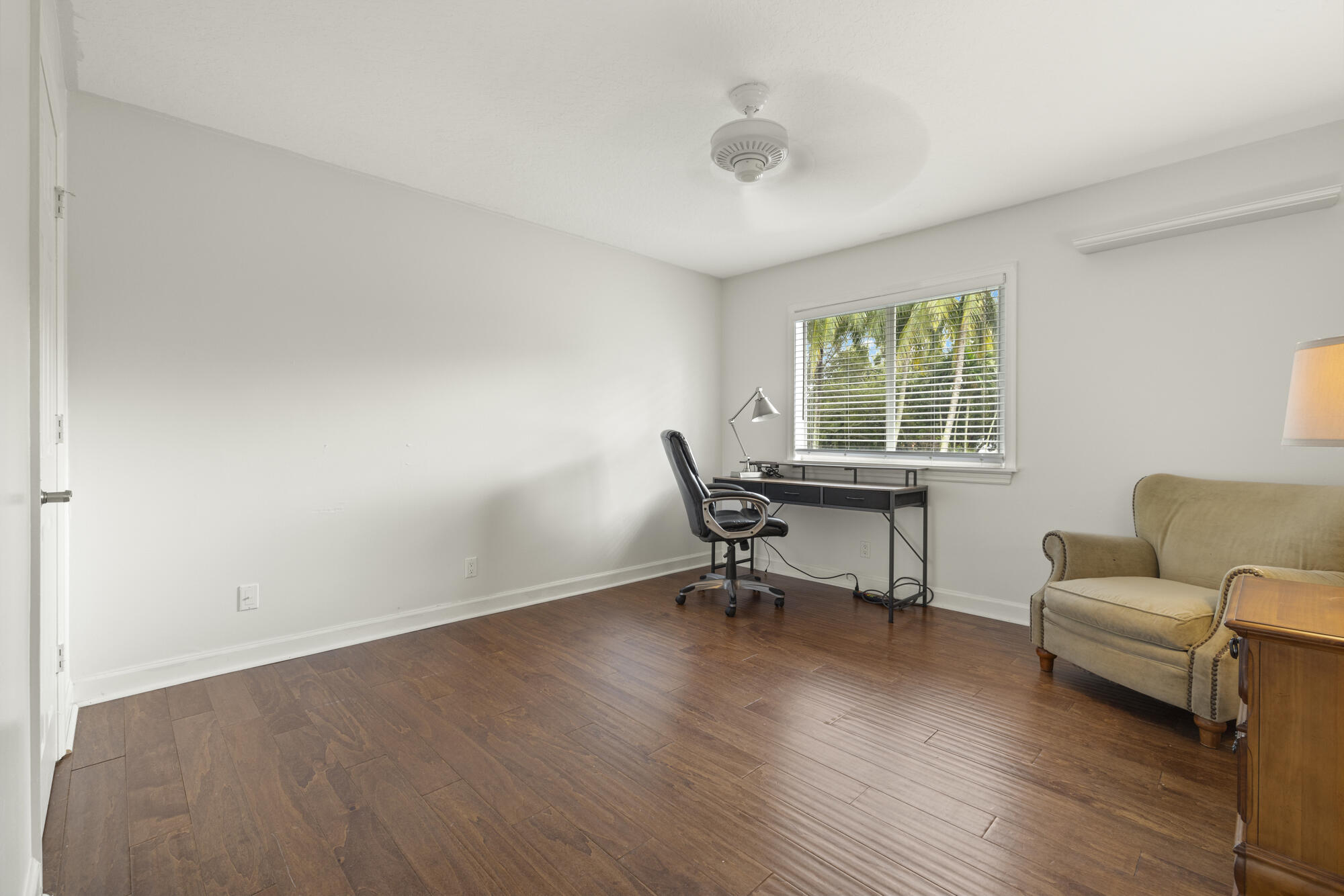 6595 Wood Lake Road Jupiter, FL 33458 - Photo 38 of 54 a living room with furniture and a window