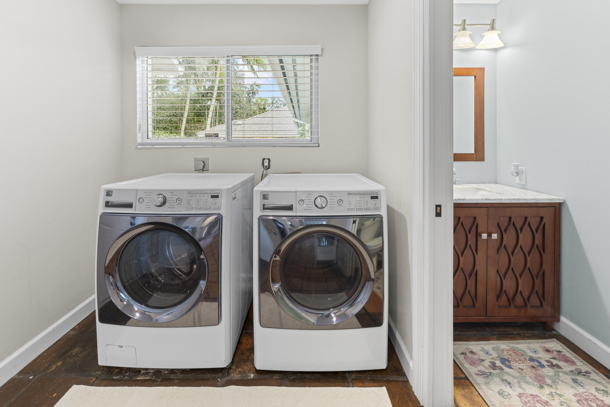 6595 Wood Lake Road Jupiter, FL 33458 - Photo 39 of 54 a utility room with dryer and washer