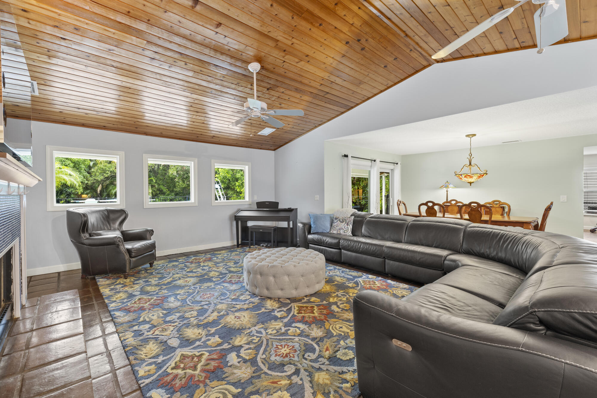 6595 Wood Lake Road Jupiter, FL 33458 - Photo 5 of 54 a living room with furniture and a large window