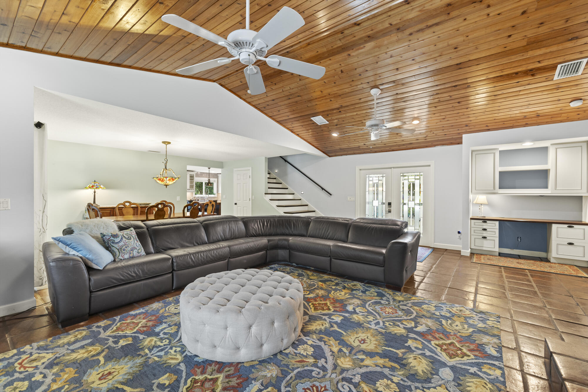 6595 Wood Lake Road Jupiter, FL 33458 - Photo 6 of 54 a living room with furniture and a wooden floor