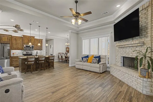 a living room with fireplace furniture and a flat screen tv