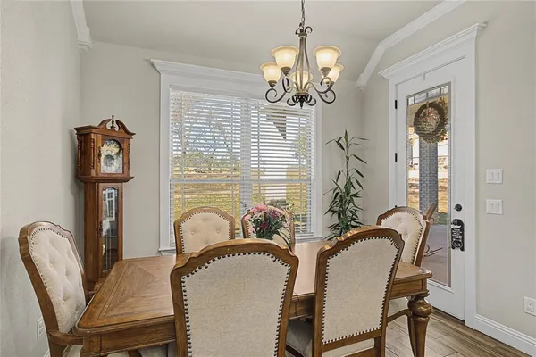 a dining room with furniture and window