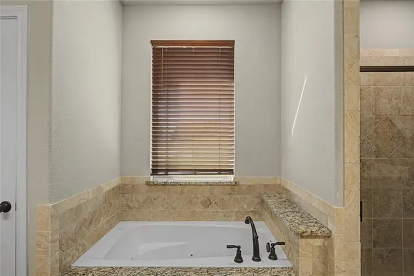 a bathroom with a bath tub