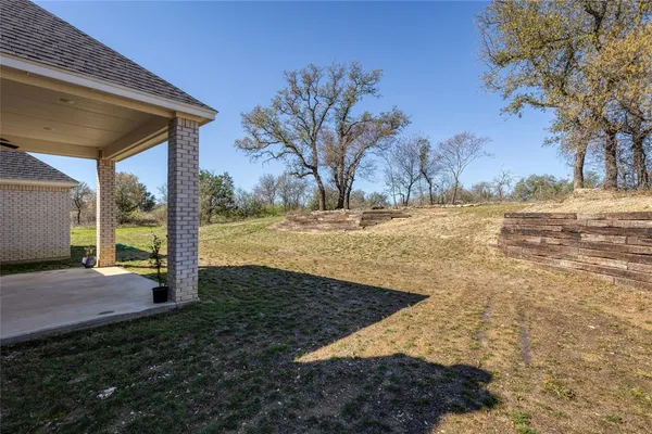 a view of a backyard of the house