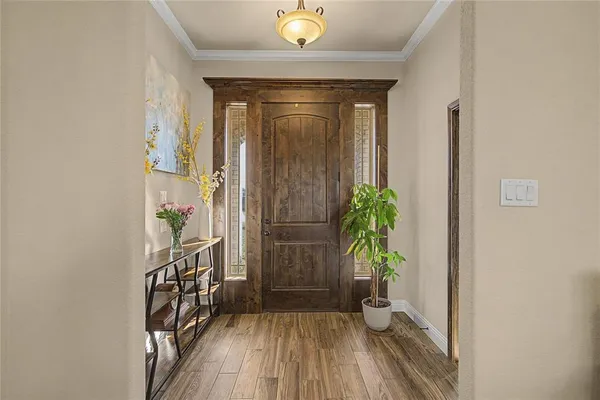 a view of entryway with wooden floor