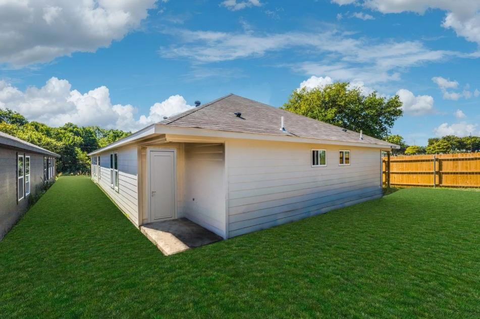 3165-3167 Stag Road Dallas, TX 75241 - Photo 2 of 7 a view of a backyard with plants and a garden