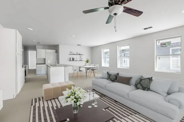 a living room with furniture and a window