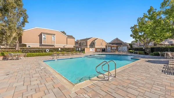 a view of swimming pool with lounge chair