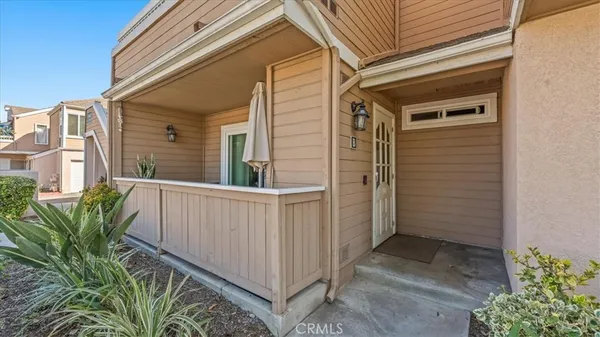 a view of a house with a small yard