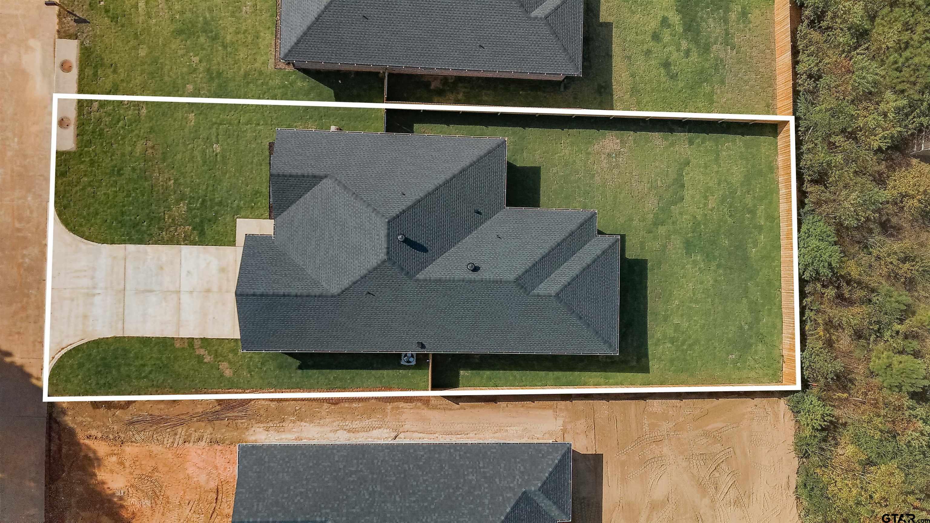 1203 Penny Lane Kilgore, TX 75662 - Photo 2 of 24 an aerial view of a house with a yard