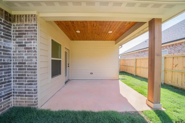 a view of a house with a yard and garage