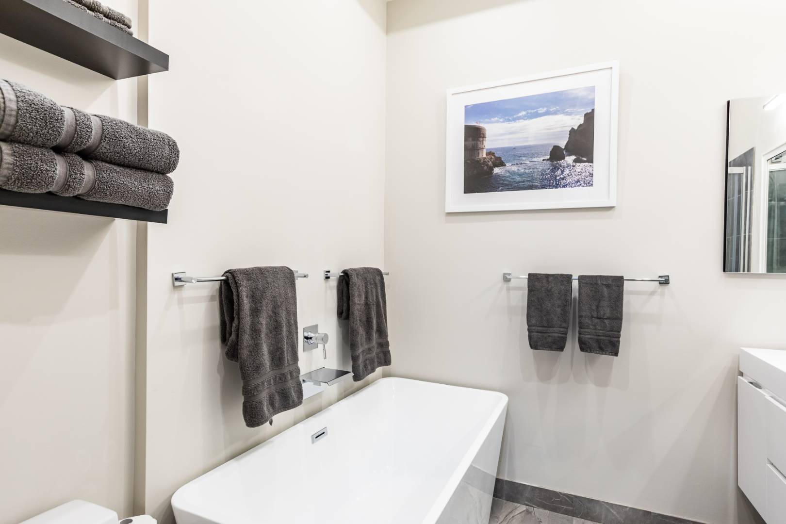 54 Johnson Avenue Southampton, NY 11968 - Photo 17 of 24 a bathroom with a toilet sink and mirror