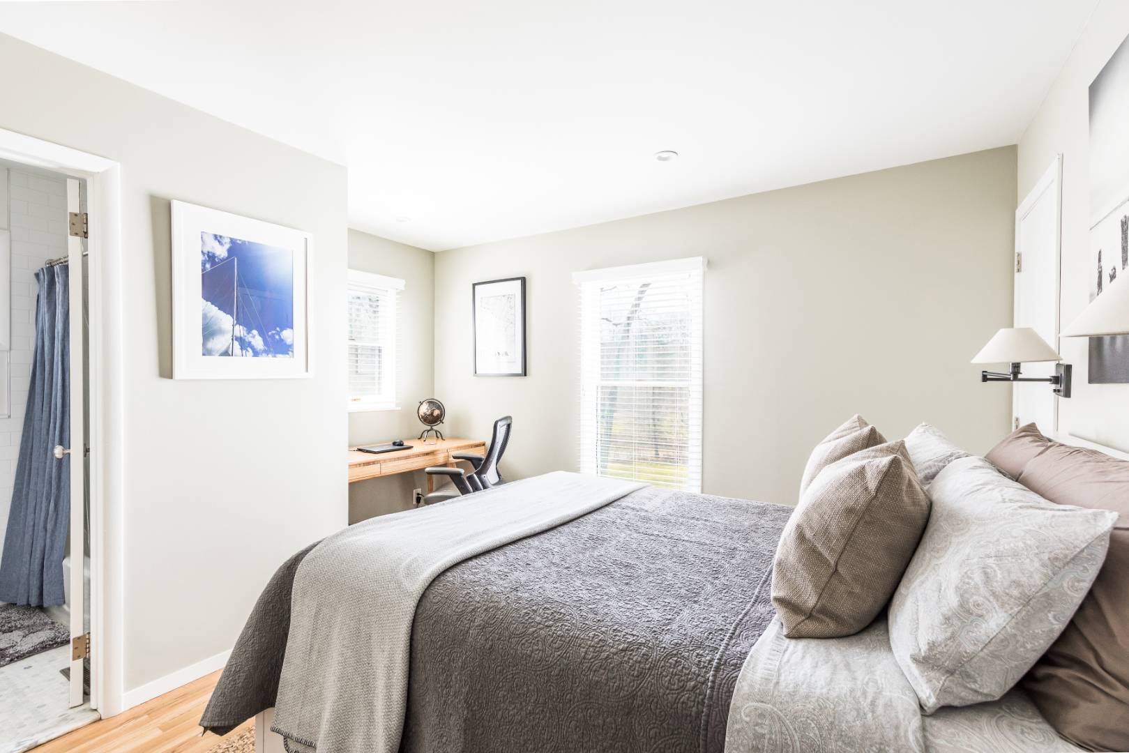 54 Johnson Avenue Southampton, NY 11968 - Photo 19 of 24 a bedroom with a bed and a large mirror