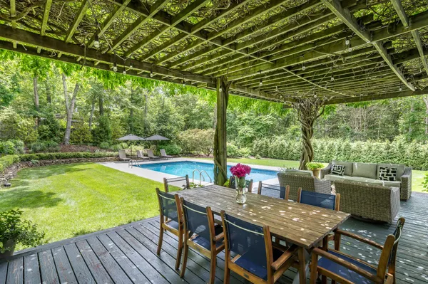 a view of a swimming pool with a yard