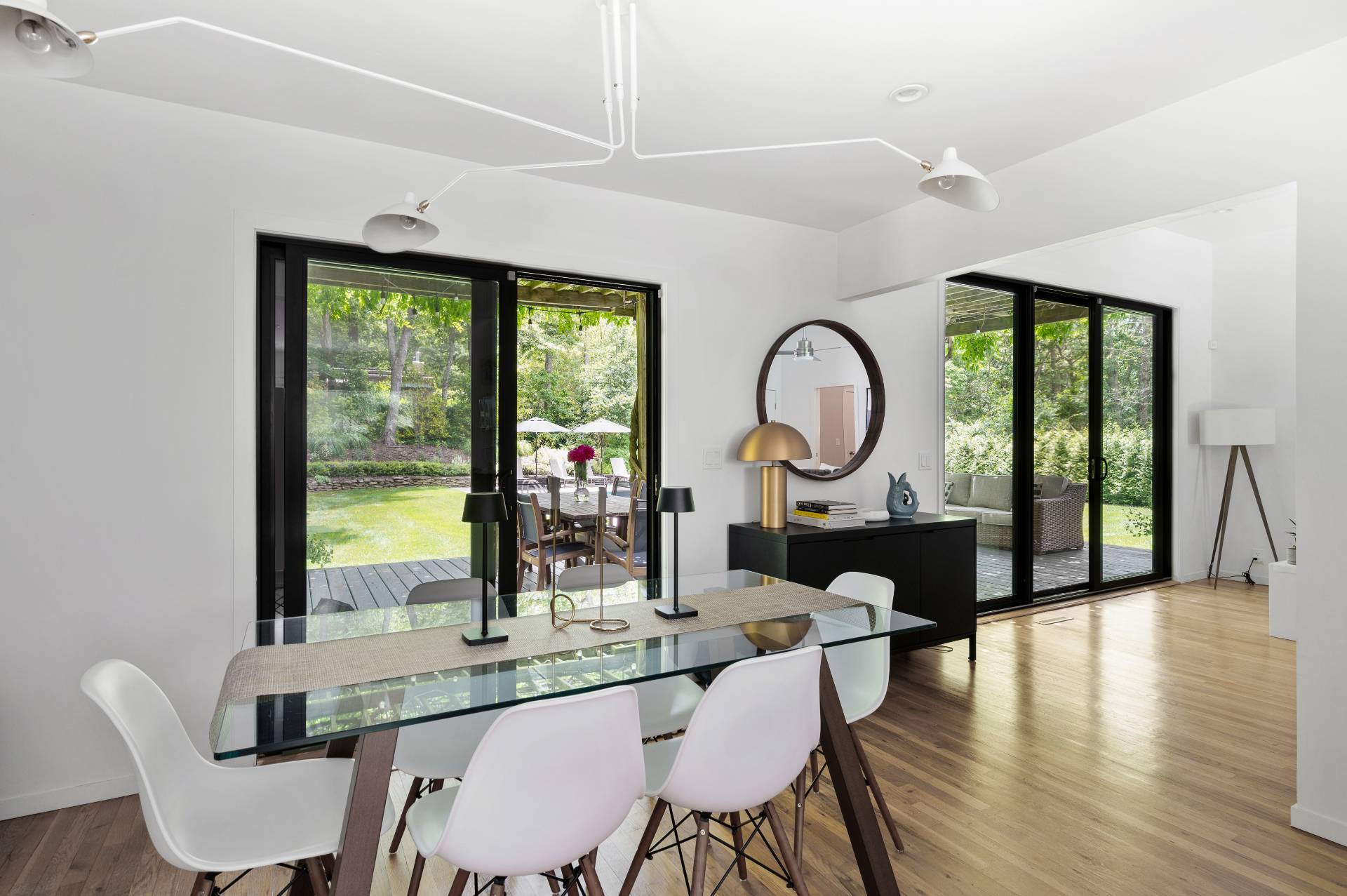 54 Johnson Avenue Southampton, NY 11968 - Photo 10 of 24 a dining room with furniture a chandelier and wooden floor