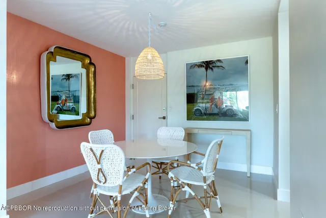 a view of a dining room with furniture and a window