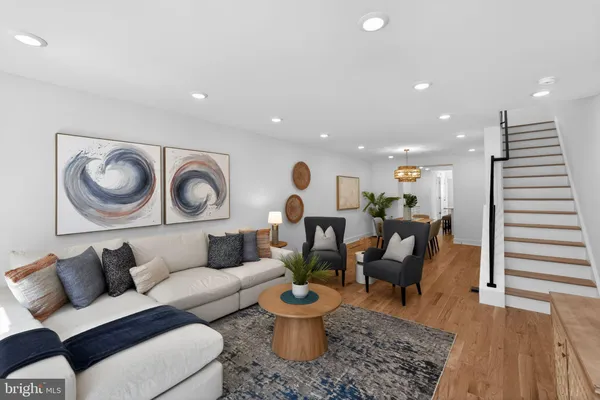 a living room with furniture and a chair