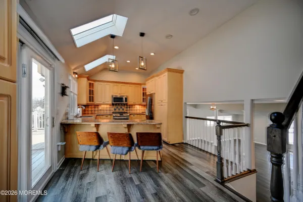 a dining room with furniture and wooden floor