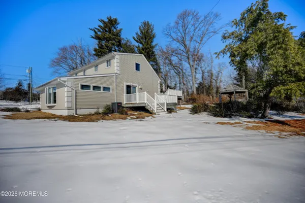 a view of the backyard of the house