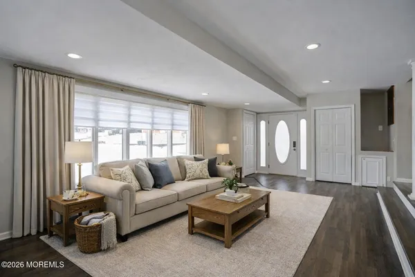 a living room with furniture and a large window