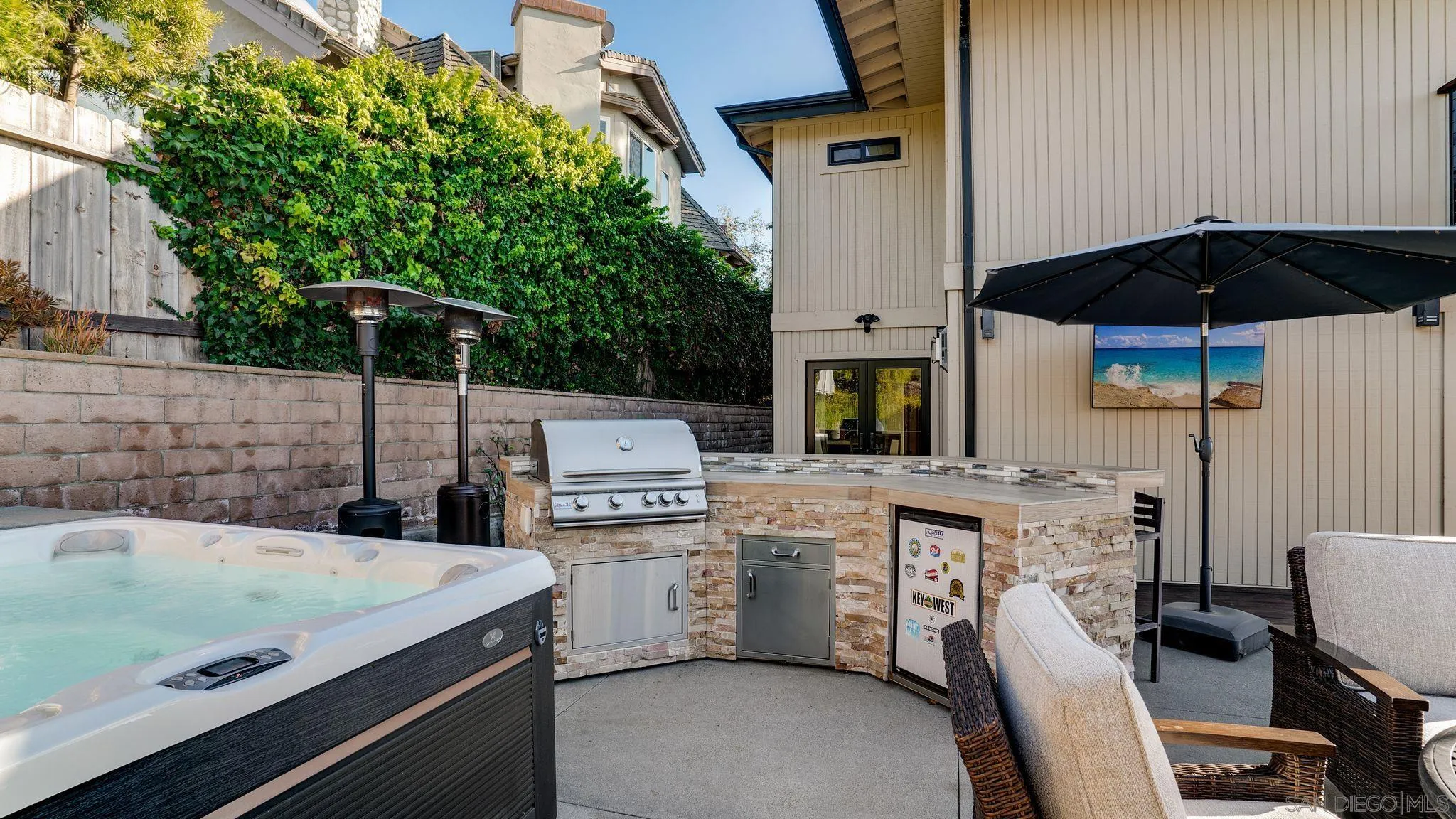 320 Del Mar Heights Road Del Mar, CA 92014 - Photo 11 of 49 a kitchen with a sink a stove and chairs