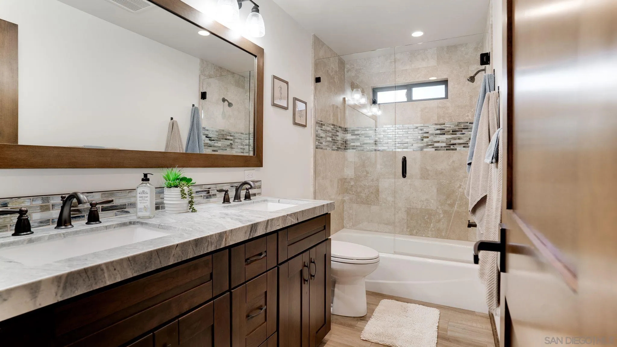 320 Del Mar Heights Road Del Mar, CA 92014 - Photo 23 of 49 a bathroom with a granite countertop sink toilet and shower