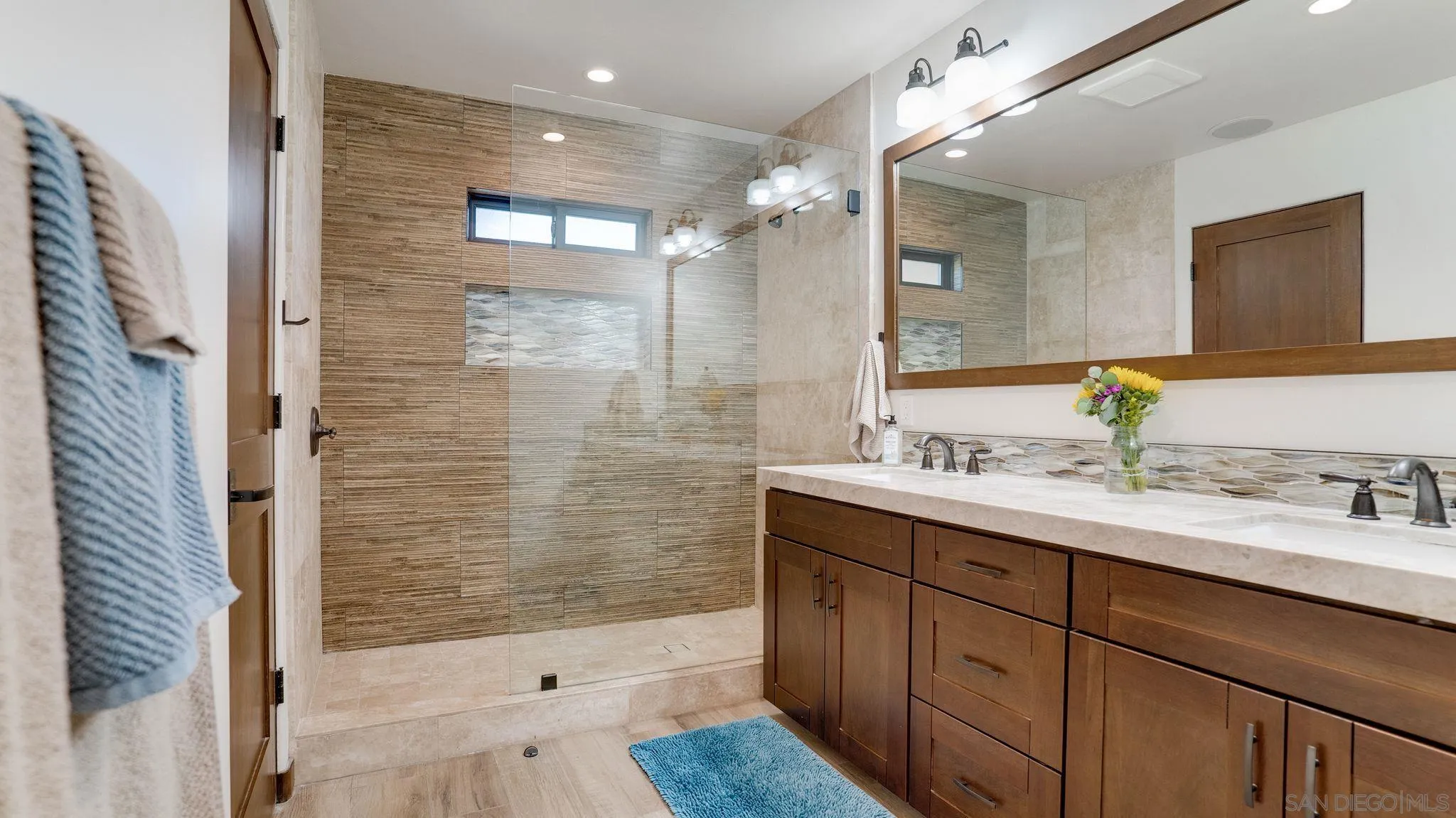320 Del Mar Heights Road Del Mar, CA 92014 - Photo 25 of 49 a bathroom with a shower sink and mirror