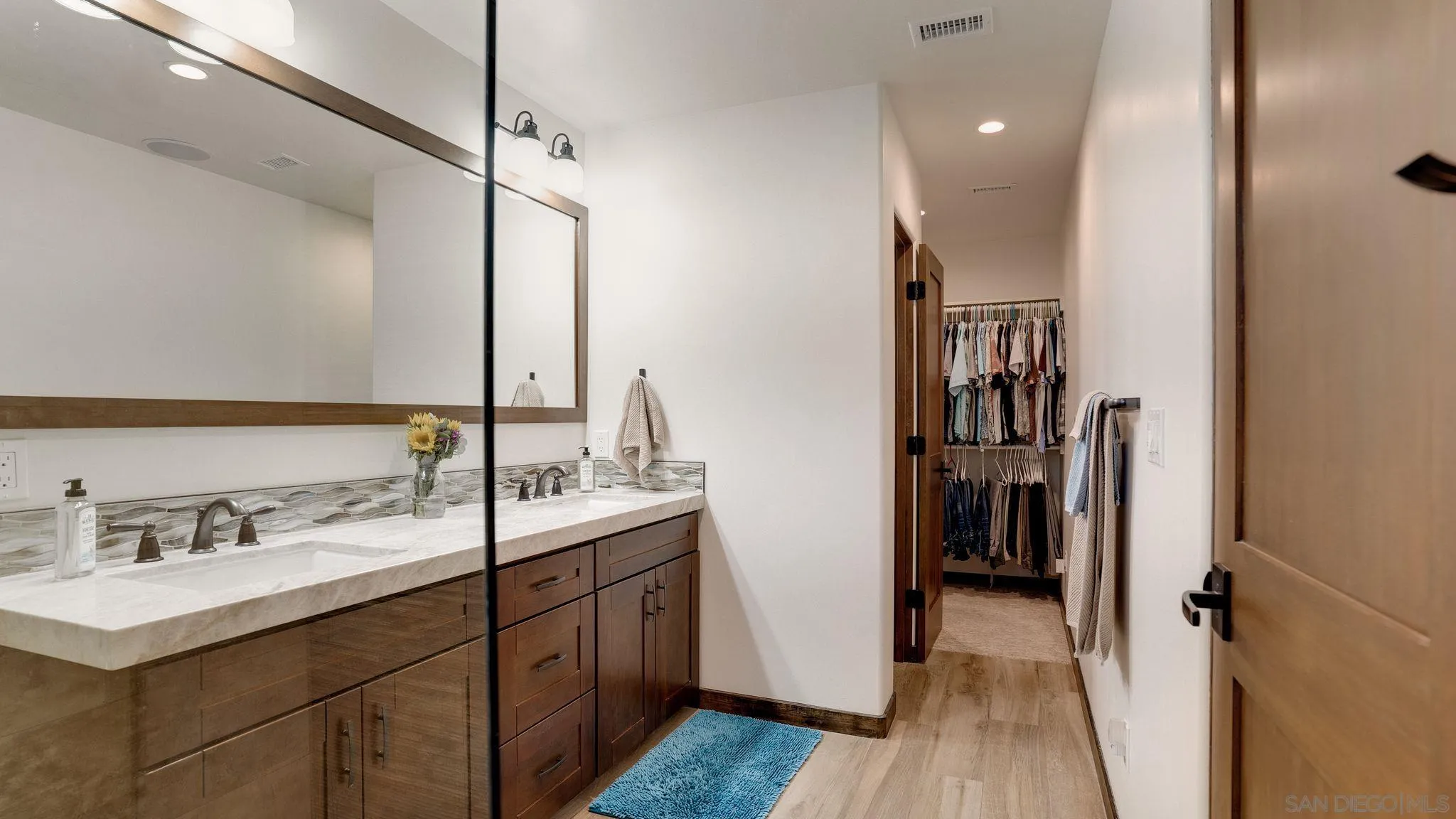 320 Del Mar Heights Road Del Mar, CA 92014 - Photo 26 of 49 a en suite bathroom with a sink double vanity and a mirror