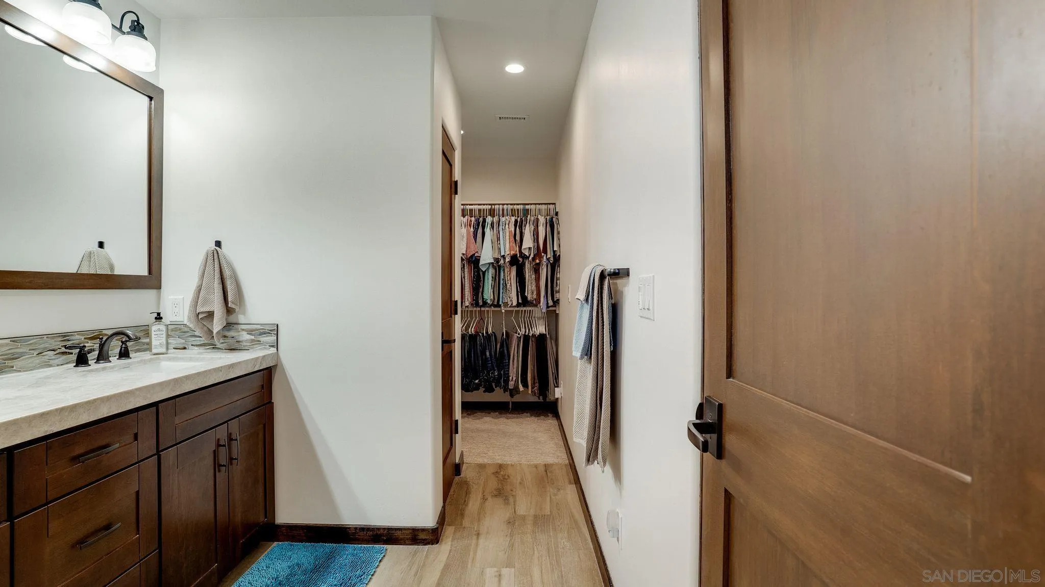 320 Del Mar Heights Road Del Mar, CA 92014 - Photo 27 of 49 a bathroom with a sink and a mirror