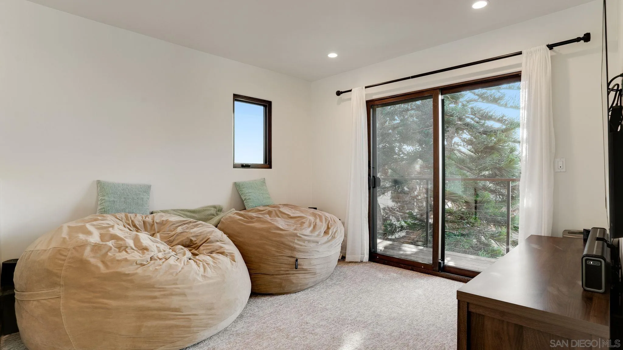 320 Del Mar Heights Road Del Mar, CA 92014 - Photo 36 of 49 a bedroom with bed and glass door