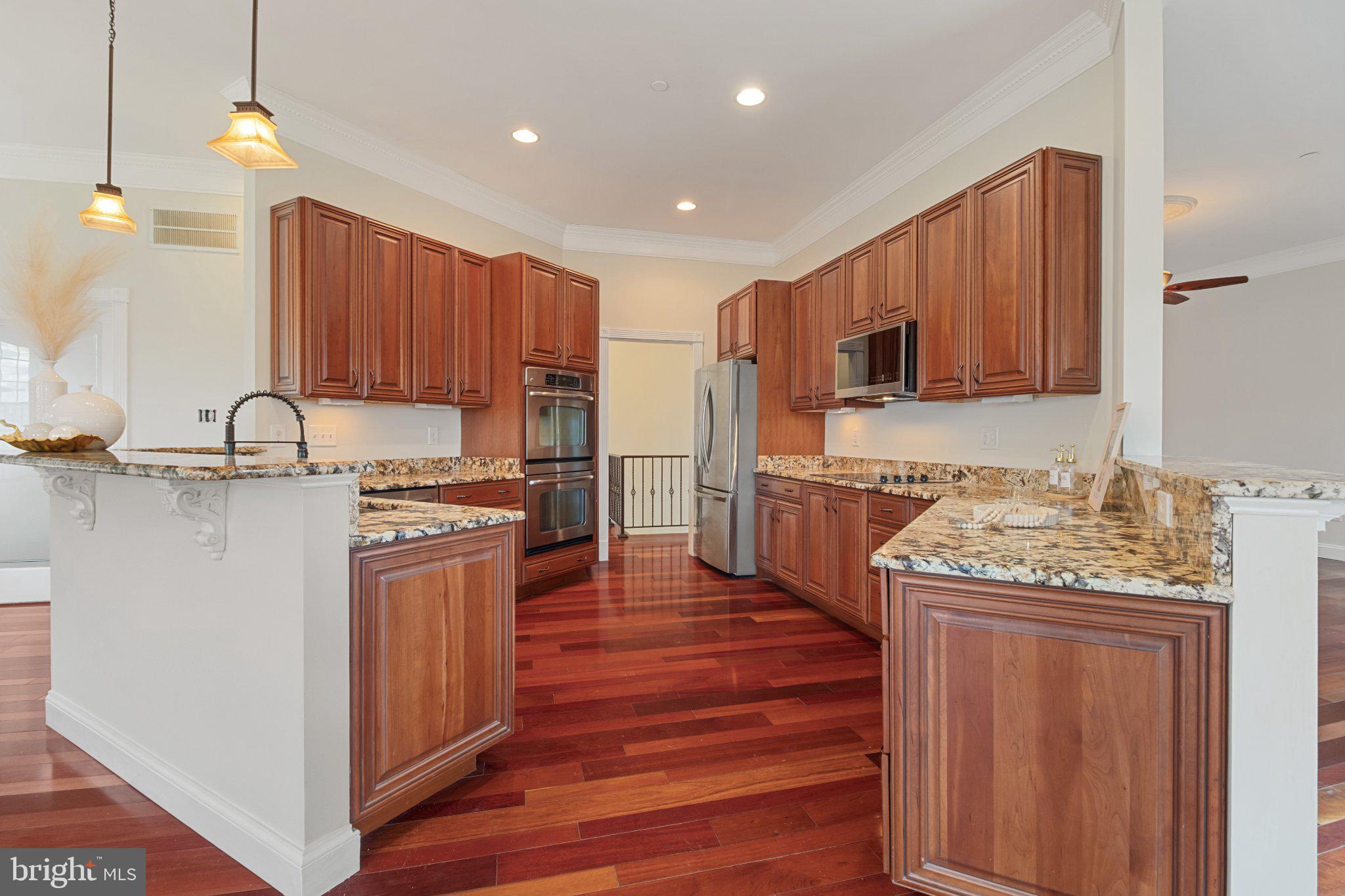 7147 Linganore Road New Market, MD 21774 - Photo 12 of 44 Elegant kitchen with rich wood tones.