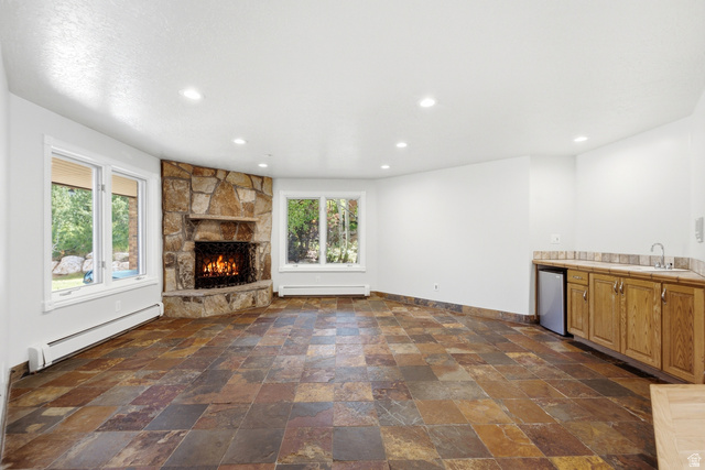3535 Homestead Road Park City, UT 84098 - Photo 10 of 81 Corner stone fireplace with hearth, complemented by multi-toned slate tile flooring