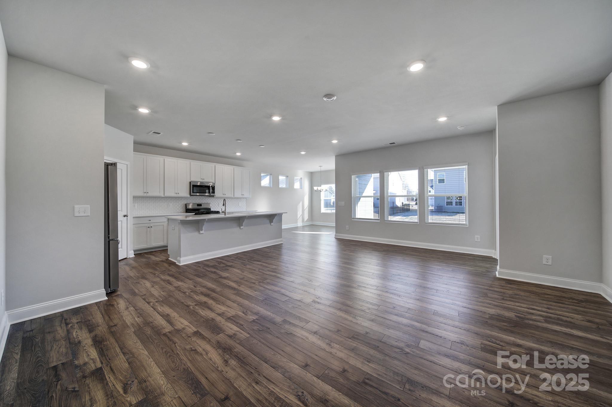 1112 Bradford Pear Road Monroe, NC 28112 - Photo 11 of 33 a view of an empty room and a kitchen