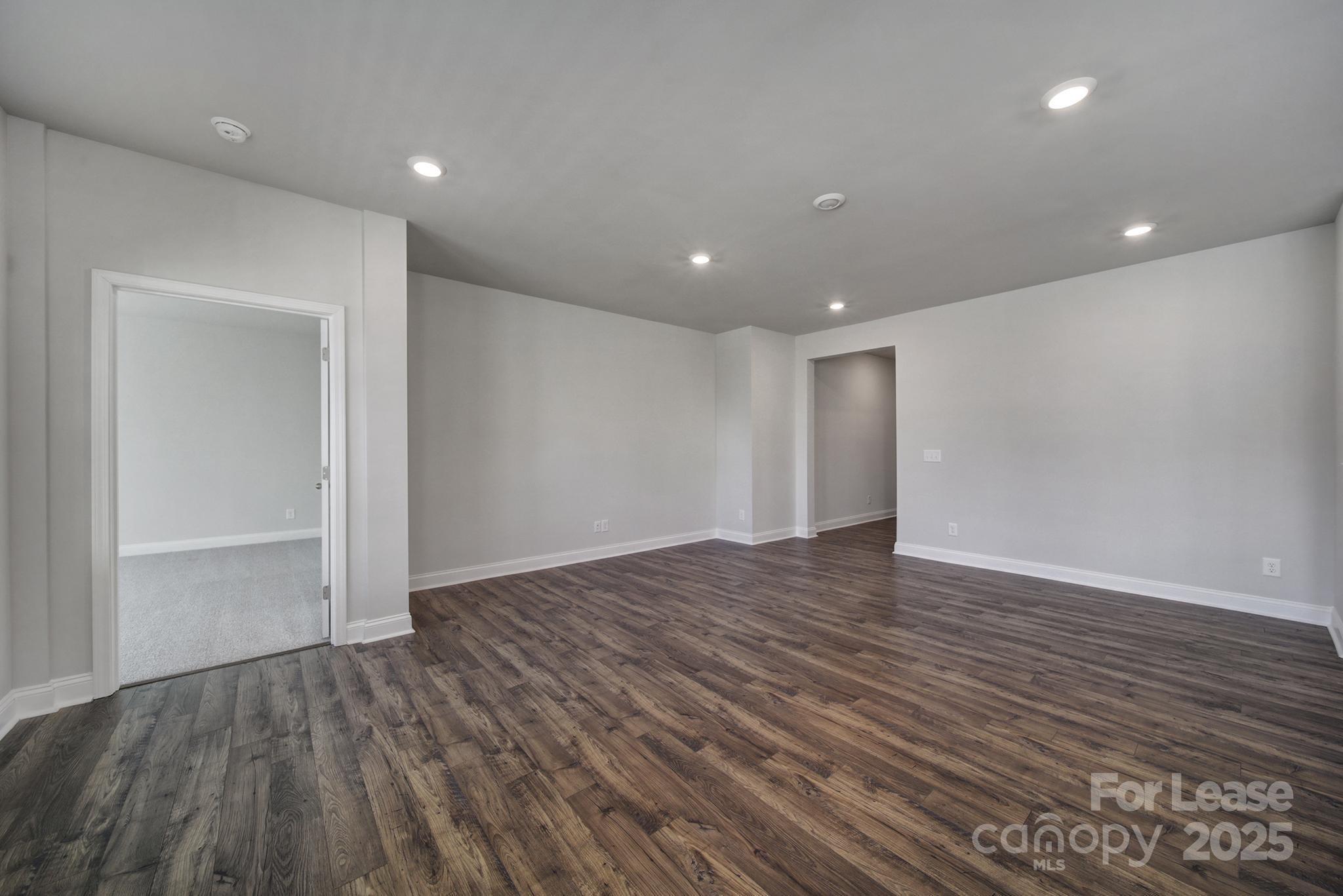 1112 Bradford Pear Road Monroe, NC 28112 - Photo 13 of 33 a view of an empty room with wooden floor and closet