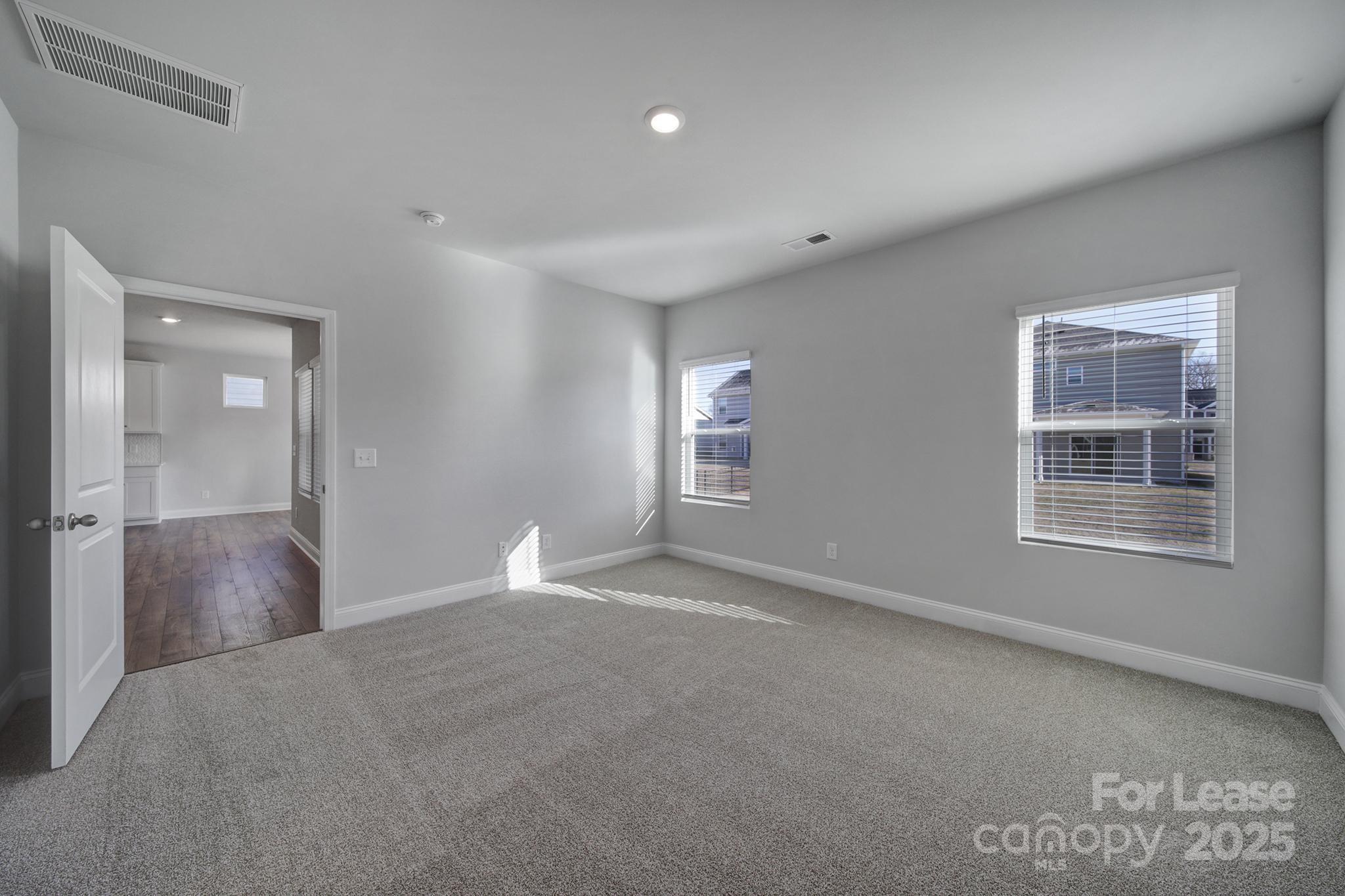 1112 Bradford Pear Road Monroe, NC 28112 - Photo 23 of 33 an empty room with windows and closet