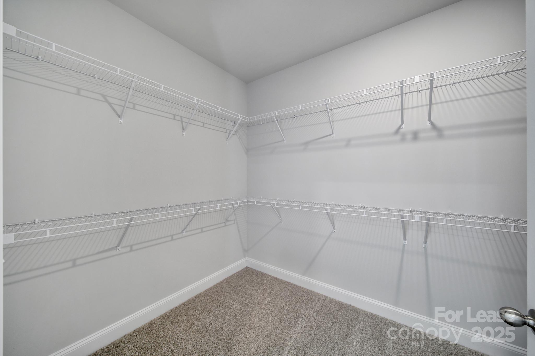 1112 Bradford Pear Road Monroe, NC 28112 - Photo 26 of 33 a view of a room with racks on the wall