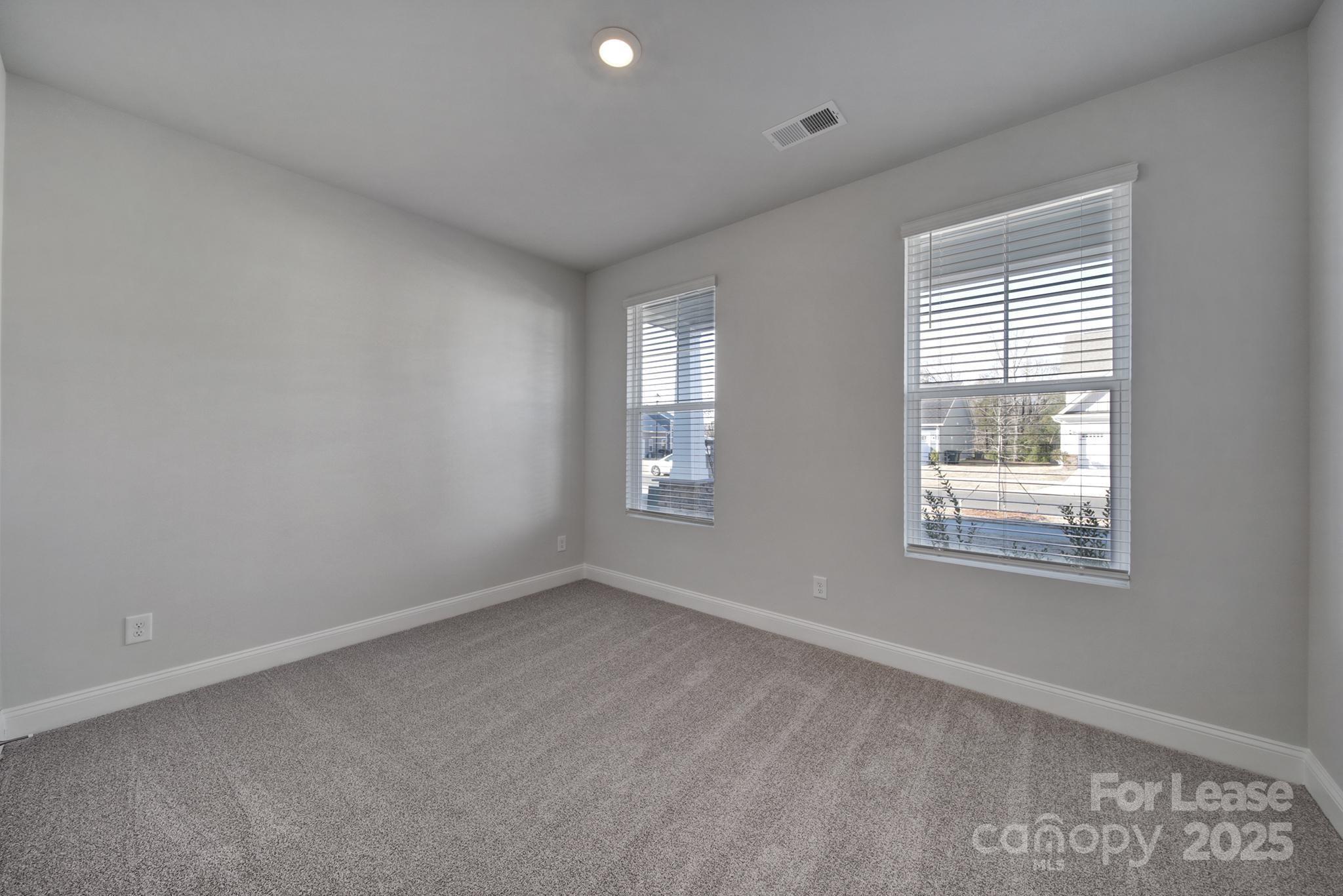 1112 Bradford Pear Road Monroe, NC 28112 - Photo 3 of 33 a view of an empty room with a window