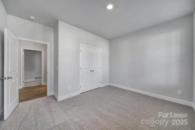 an empty room with closet area