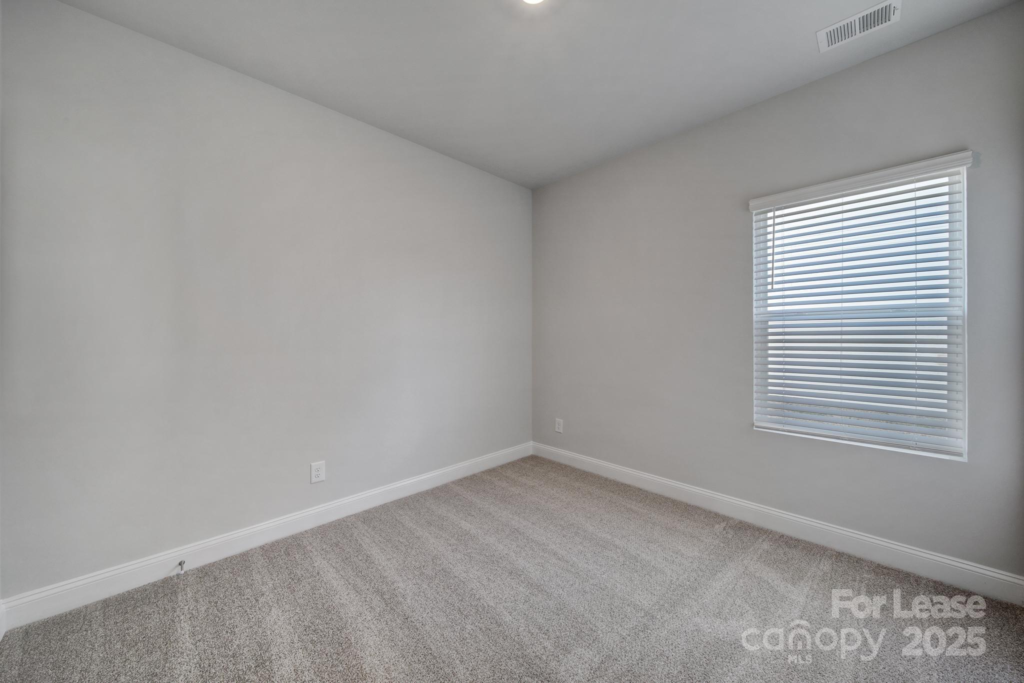 1112 Bradford Pear Road Monroe, NC 28112 - Photo 7 of 33 an empty room with a window