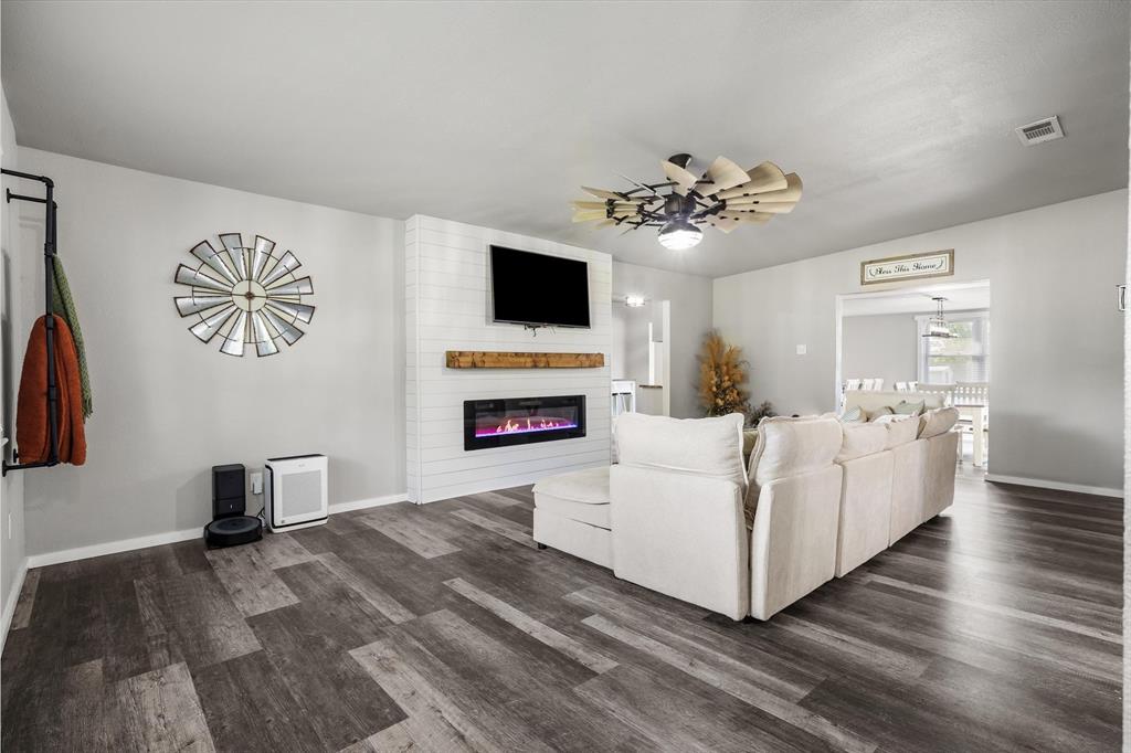 1216 VZ County Road Canton, TX 75103 - Photo 13 of 40 a living room with furniture a flat screen tv and a fireplace