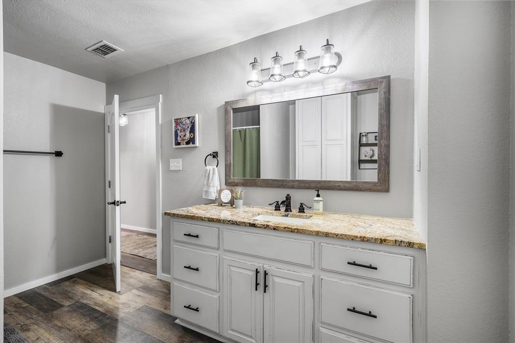 1216 VZ County Road Canton, TX 75103 - Photo 27 of 40 a bathroom with a double vanity sink and a mirror