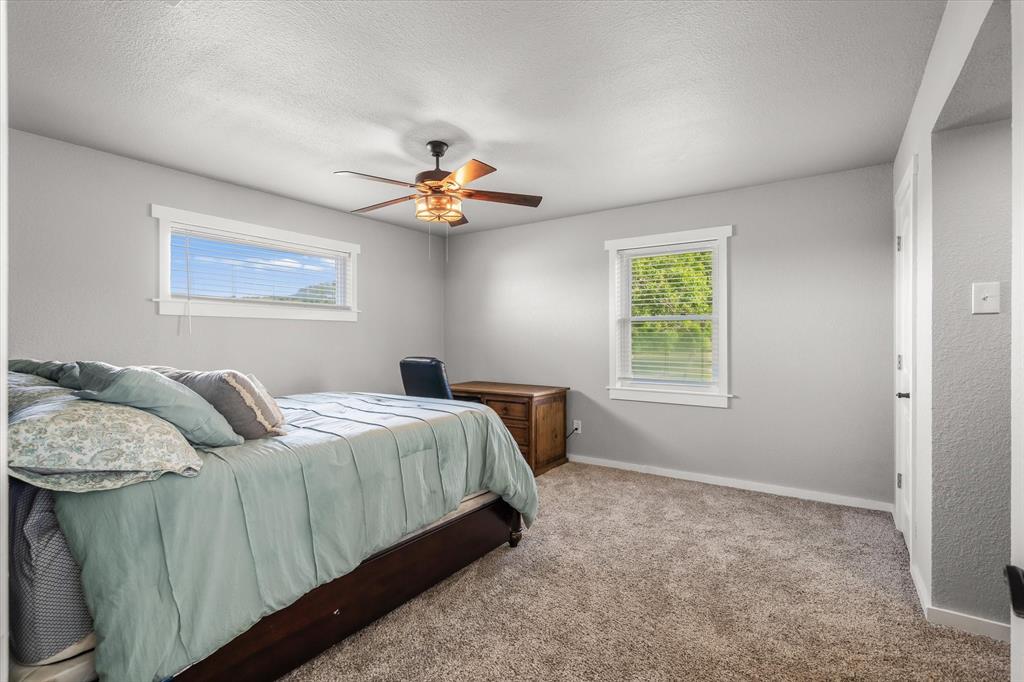 1216 VZ County Road Canton, TX 75103 - Photo 30 of 40 a bed room with a bed and a window