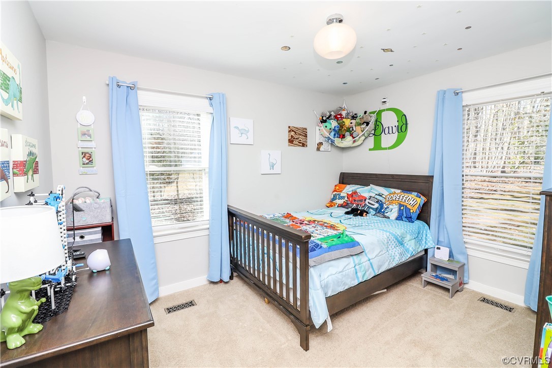 2210 Mill Road Powhatan, VA 23139 - Photo 19 of 36 a bedroom with a bed and a window