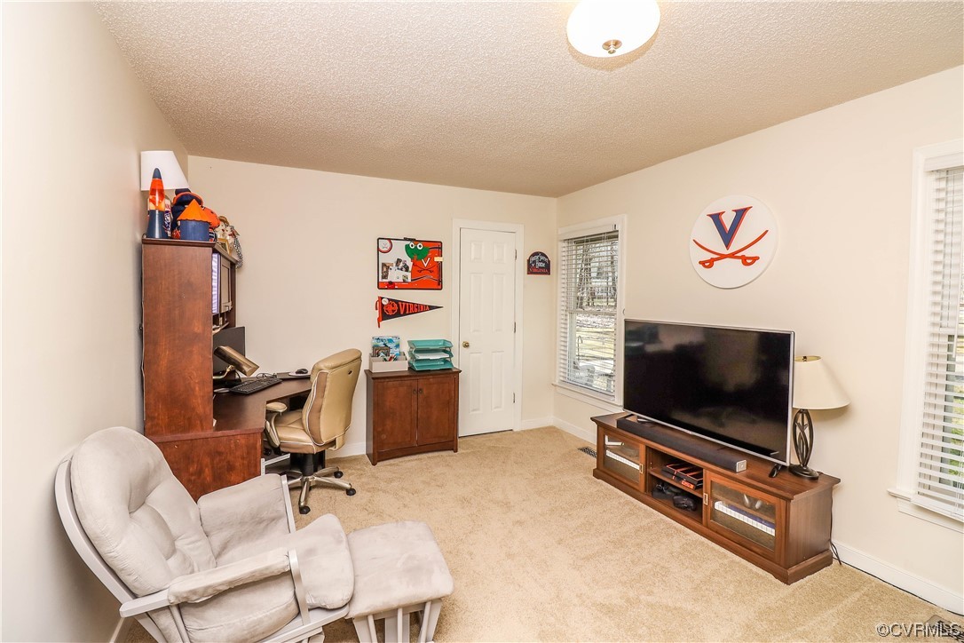 2210 Mill Road Powhatan, VA 23139 - Photo 21 of 36 a living room with furniture and a flat screen tv
