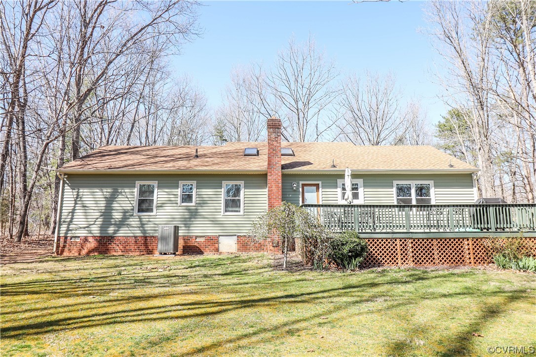 2210 Mill Road Powhatan, VA 23139 - Photo 24 of 36 a front view of a house with a garden and trees
