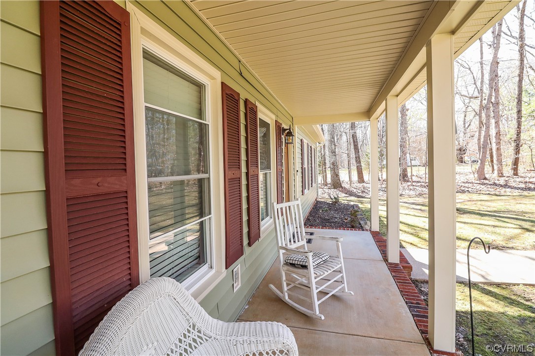 2210 Mill Road Powhatan, VA 23139 - Photo 4 of 36 a balcony view with a large window and furniture