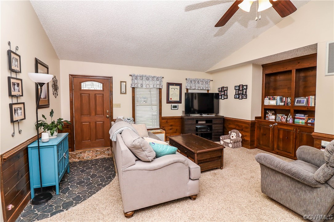 2210 Mill Road Powhatan, VA 23139 - Photo 6 of 36 a living room with furniture and a flat screen tv